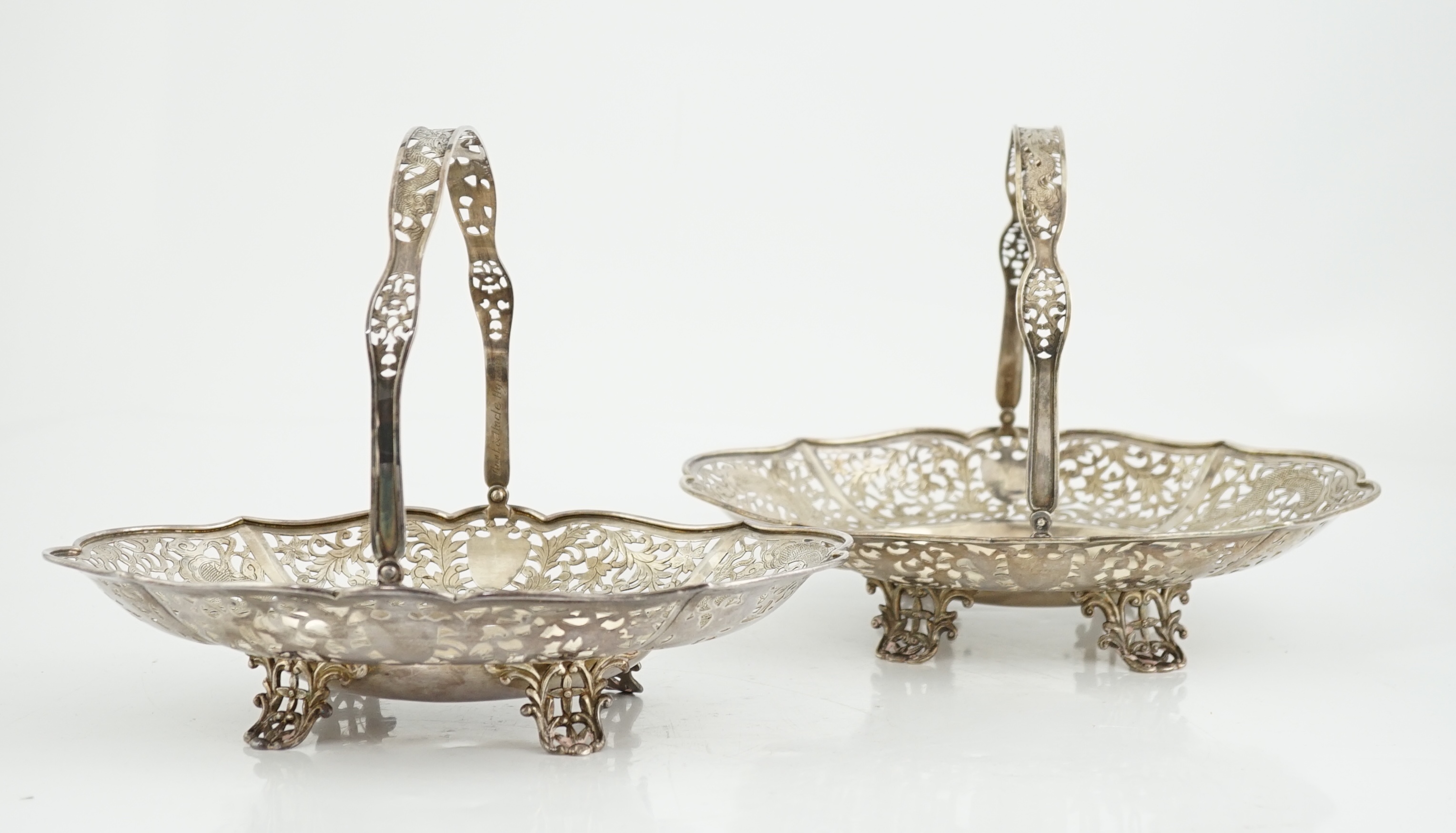 A pair of early 20th century Chinese Export pierced silver cake baskets, by Wang Hing, Hong Kong
